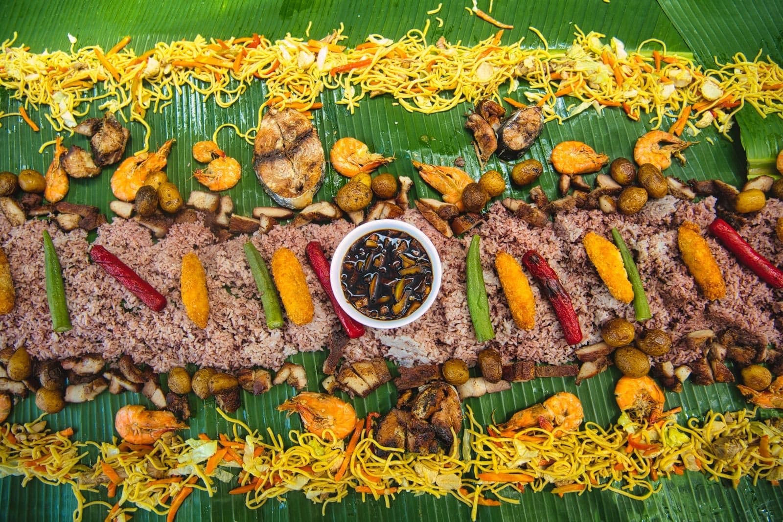 A Filipino feast laid out on banana leaves